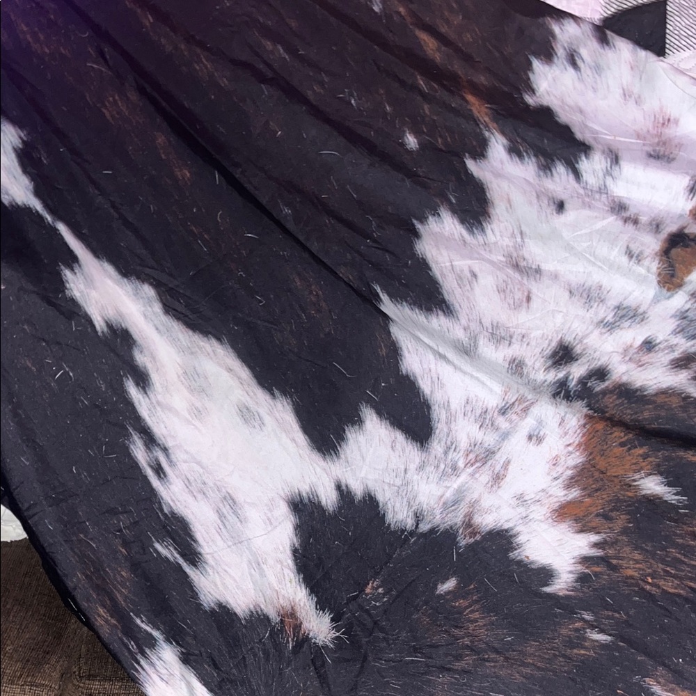 2 panels cow print curtains, rod pocket. App. 90 long and 40.5 wide, OFFERS!!